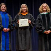 Faculty posing with award with the Provost